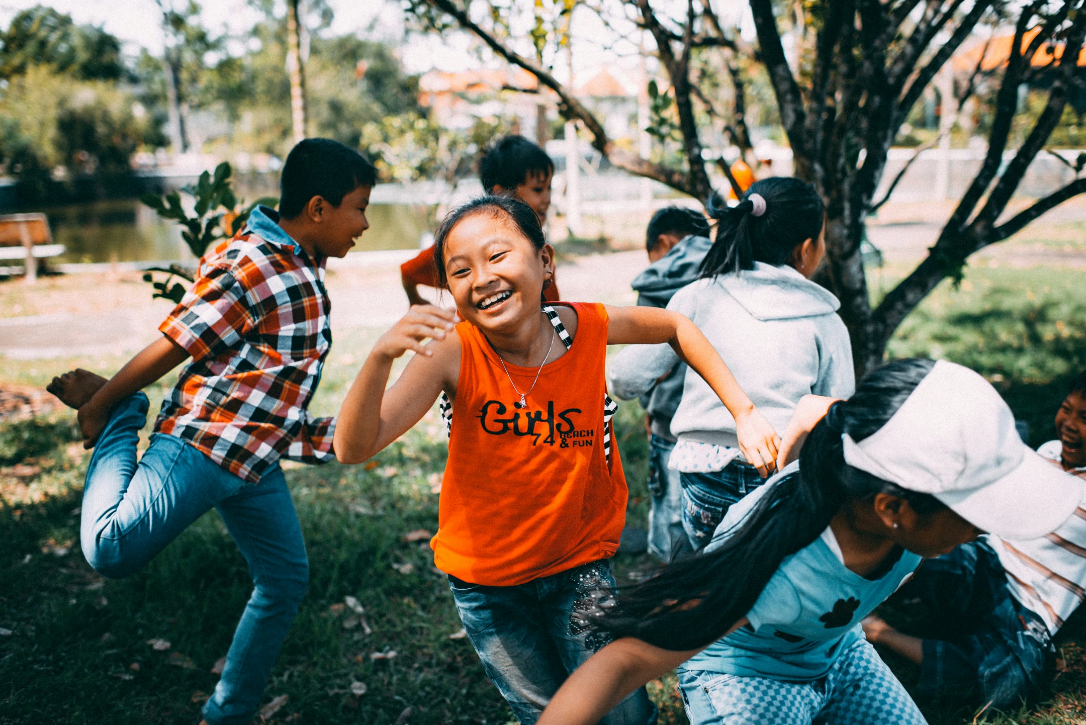 mi-pham-xtd3zYWxEs4-unsplash-optimized Children running in the park