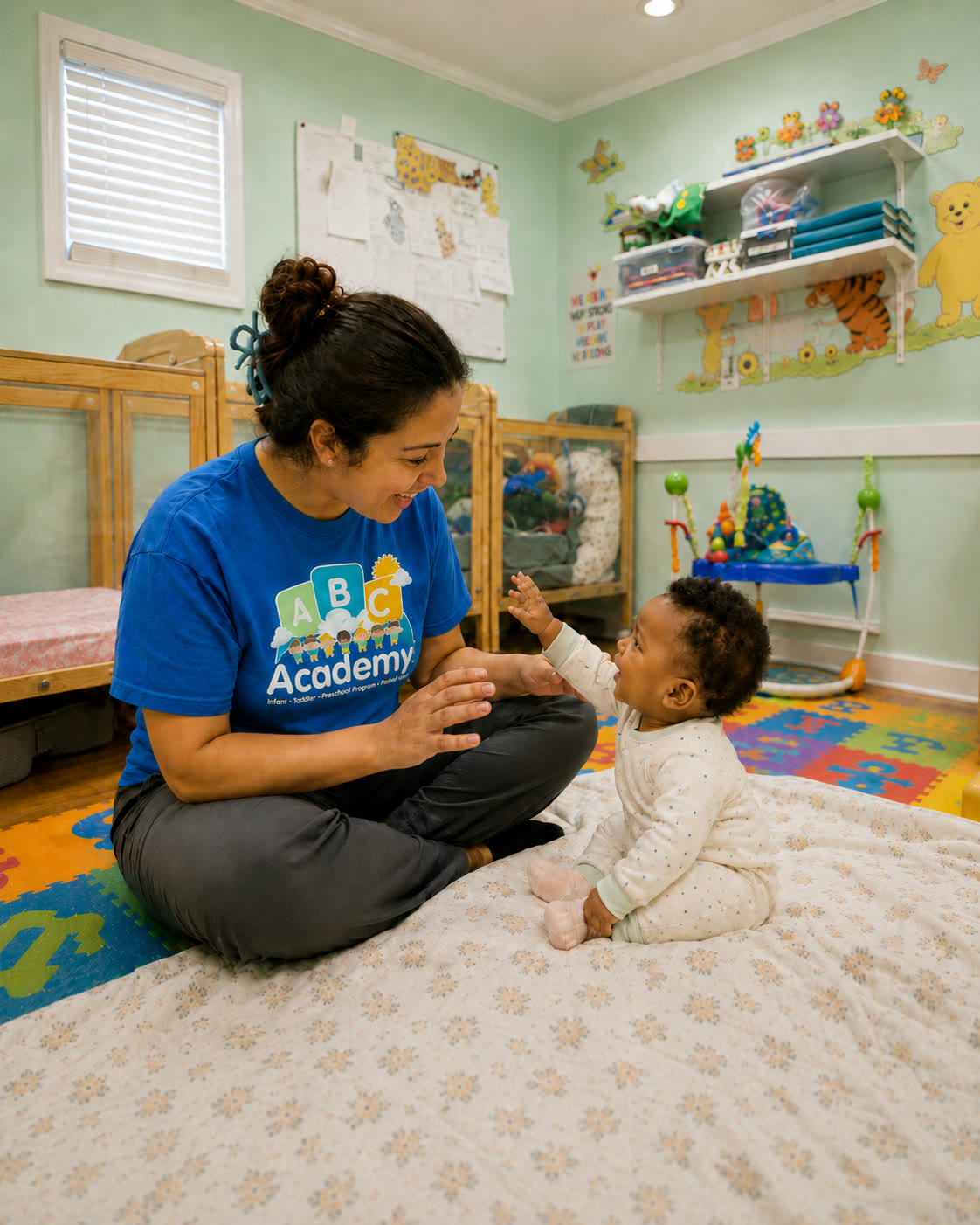 ABC Academy teacher interacting with an infant